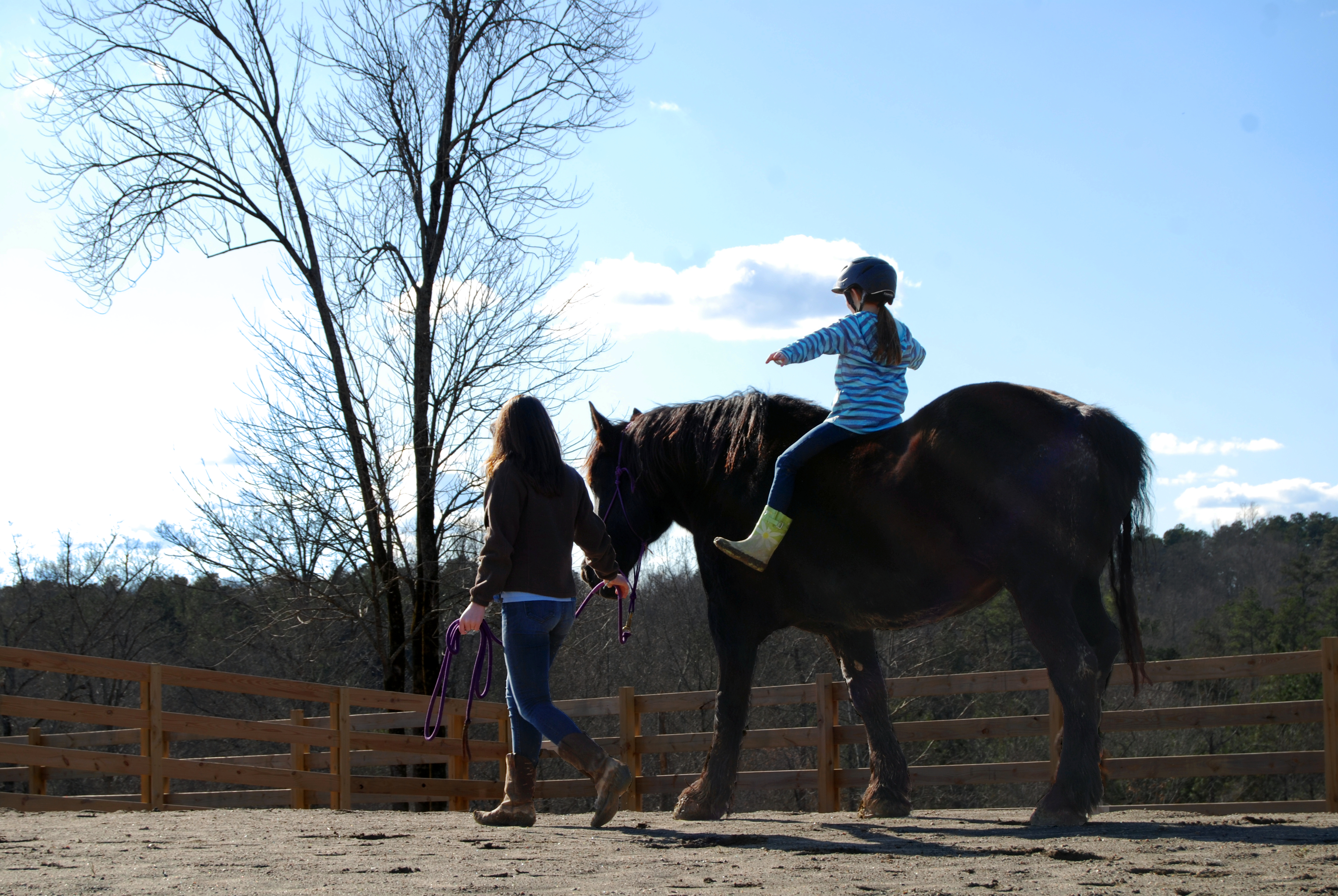 O’Conner leads horse Abby with a child aboard. She says it is humbling and powerful to hear the kids’ stories.