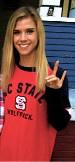 Rachel Lloyd shows her Wolfpack pride cheering on the team at Carter Finley before a big home game