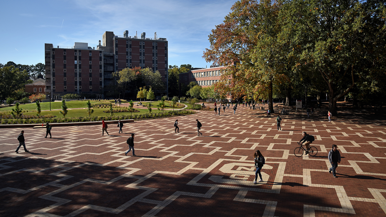 Students walk to class on North Campus at the Brickyard.