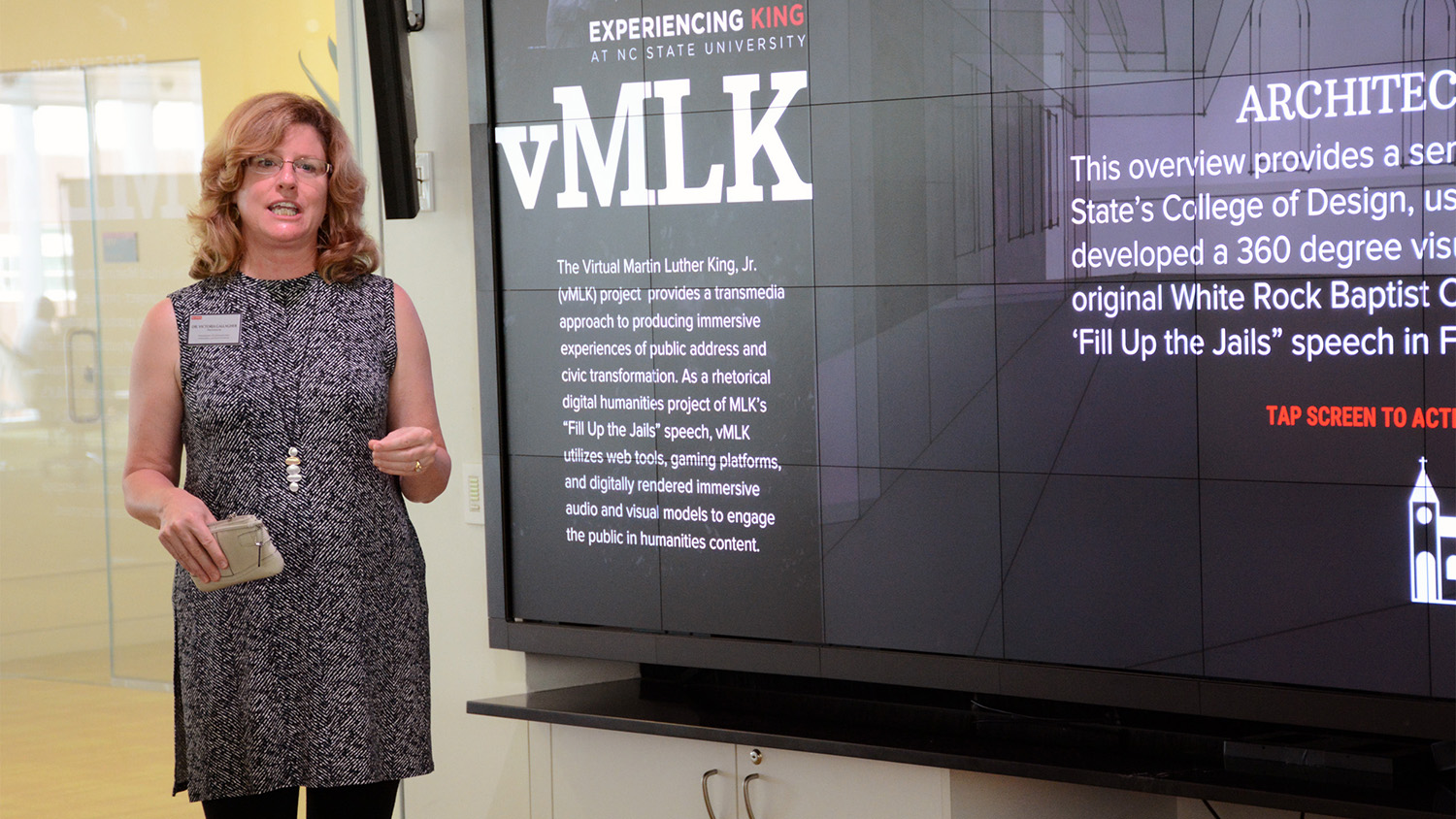 professor stands in front of vMLK exhibit