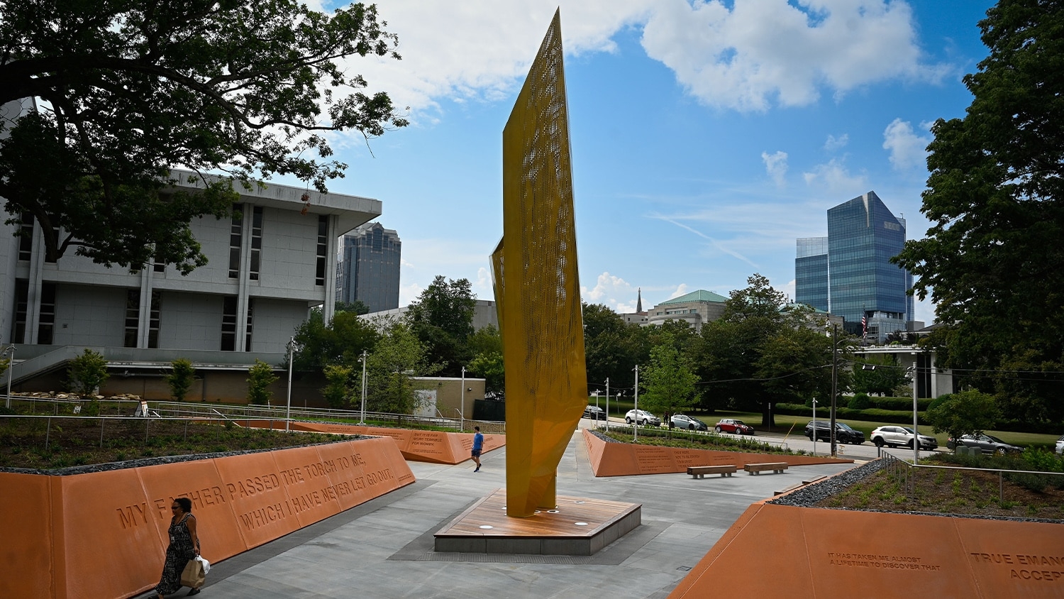 The central beacon in Freedom Park, with the Raleigh skyline in the background